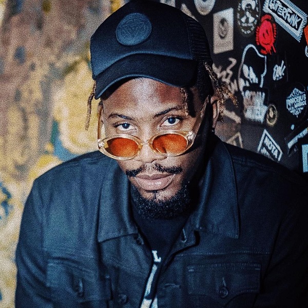 Ycee wearing glasses